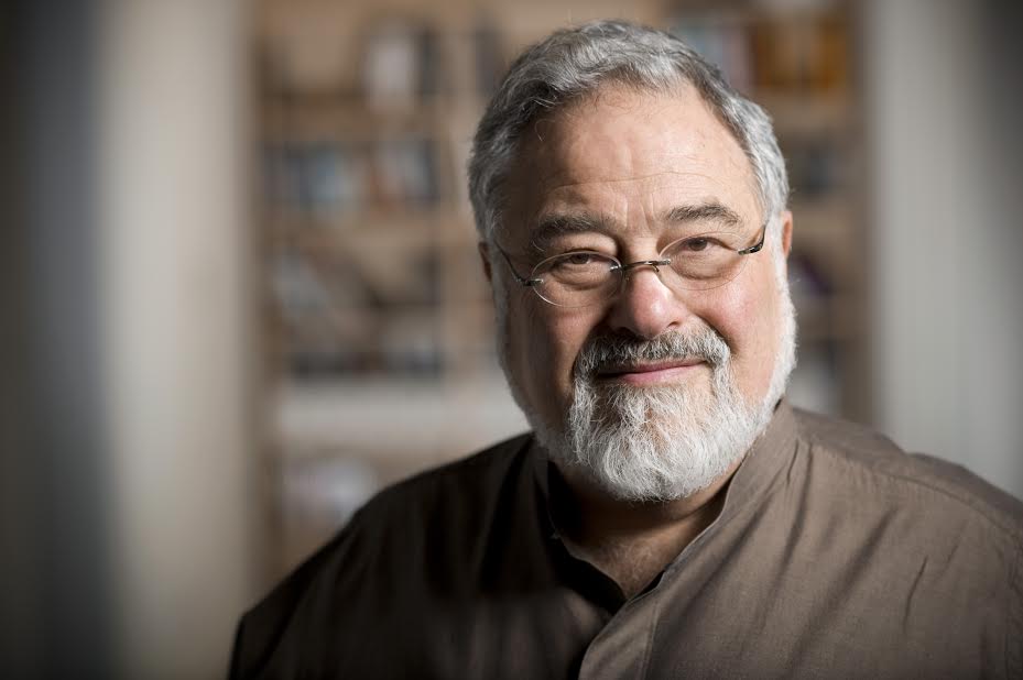Color photo of George Lakoff, an older man with a white beard and glasses, in 2012.